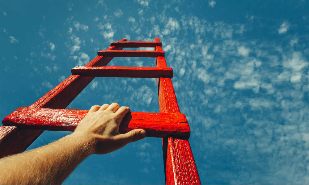 A hand on the rung of a ladder, to symbolise climbing the automotive career ladder