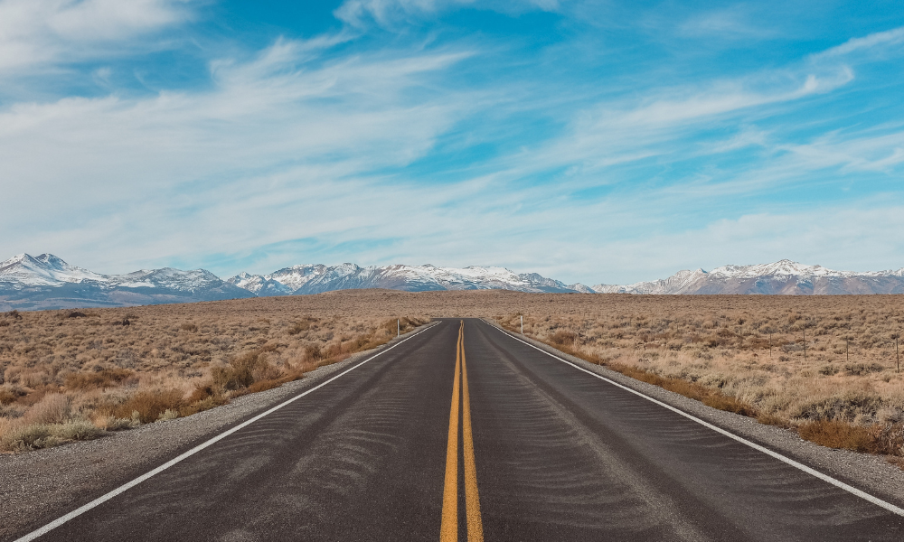 A road travelling towards distant mountains, signifying your career path at S&B Automotive Academy