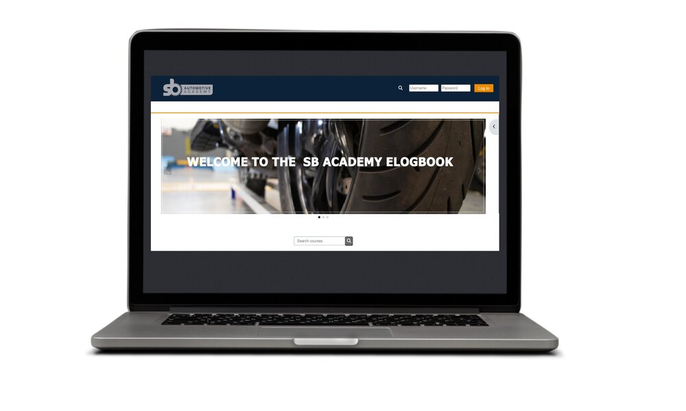 A laptop open showing the S&B Academy eLogbook website on the screen
